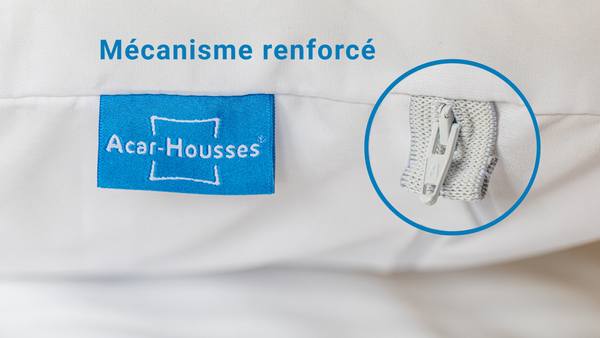Gros plan sur le mécanisme renforcé de la housse anti-acariens, avec curseur de fermeture